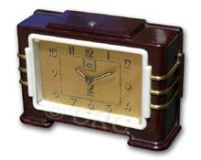 Jaz brown bakelite with white plaskon and brass trim clock